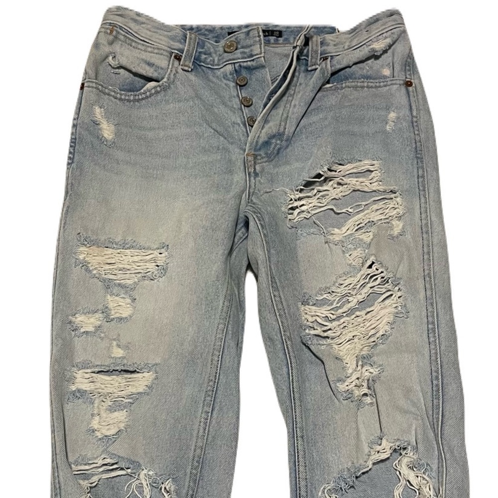 Popular and comfortable distressed Abercrombie & Fitch button fly jeans.